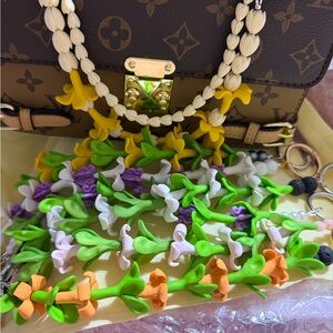 Purse Lei made with Puakenikeni, Pikake, pakalana flowers.